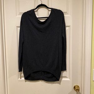 Dark Grey and pink uneven hem sweater. The back has a zipper sz. M